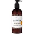 Brown bottle of Wild Wash Ultra Shine Shampoo on a white background
